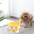 Green robot-shaped elevated cat bowl with tilted design and detachable inner food container