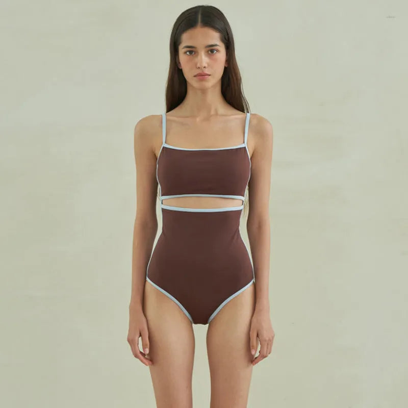 Brown triangle one-piece swimsuit for women with nylon fabric and sizes M, L, XL.