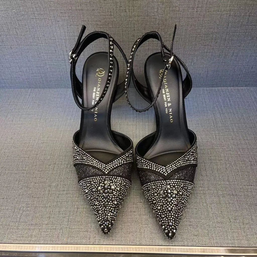 Women's hollow high heels with stiletto heel, pointed toe, and red sole in silver and black colours