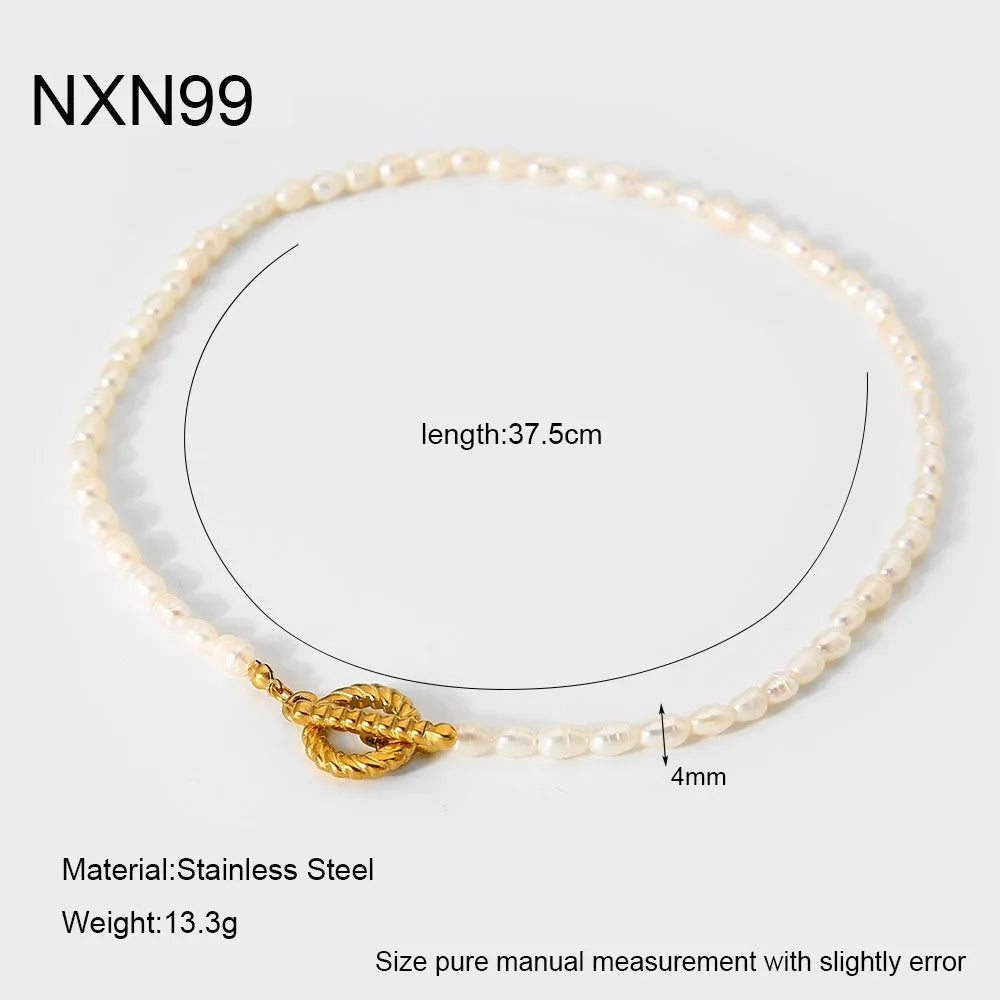 Freshwater pearl and stainless steel geometric pendant necklace and matching bracelet set for women.