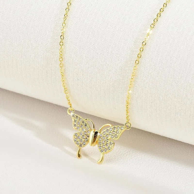 Gold magnetic snap butterfly necklace on twisted chain, adjustable 40-45cm length, titanium steel construction