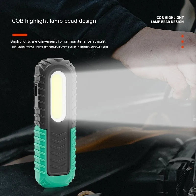 Black and green USB rechargeable auto repair work light with a durable plastic housing.