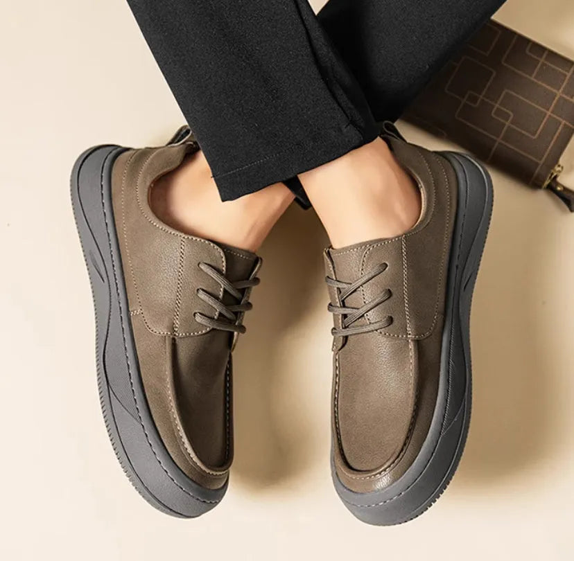 Brown retro leather casual shoes with big toe design and visible stitching on a rubber sole.