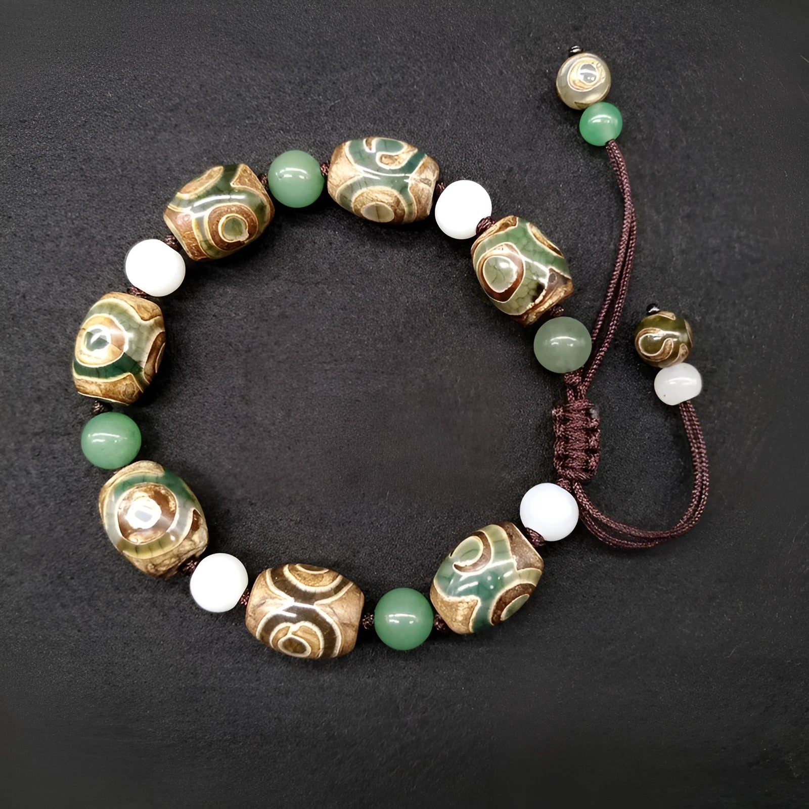 Green agate ethnic bracelet with geometric three-eye beads and adjustable closure
