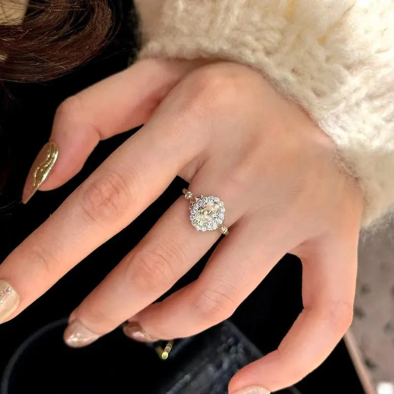 Silver adjustable geometry ring with diamond treatment and ellipse design elements for female wearers