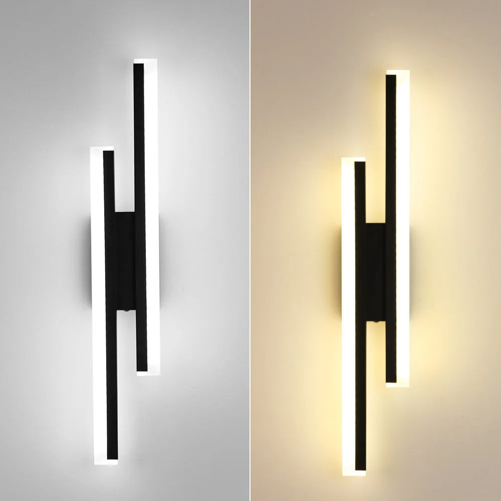 Gold-finished double line wall lamp, 500mm long, with modern design on a white wall.