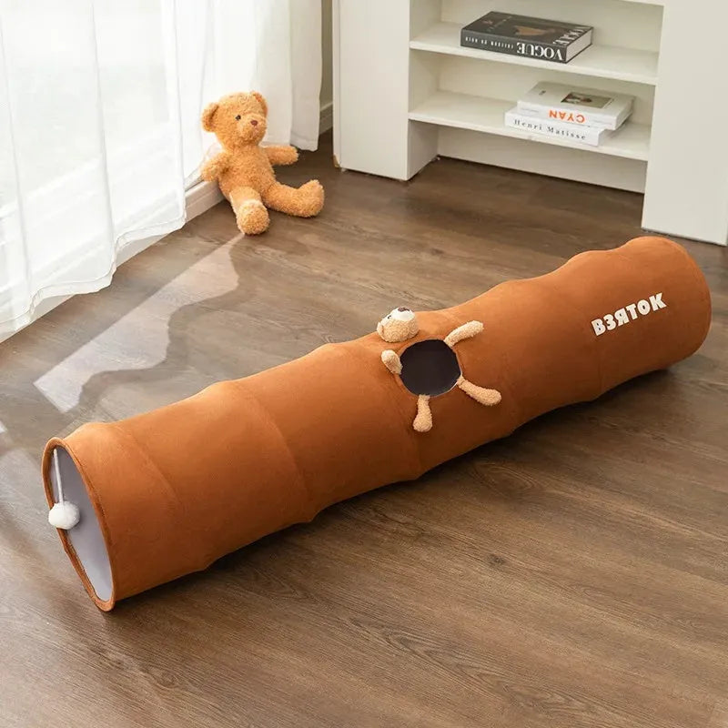 Collapsible brown cat tunnel with plush ball attached on top for indoor play