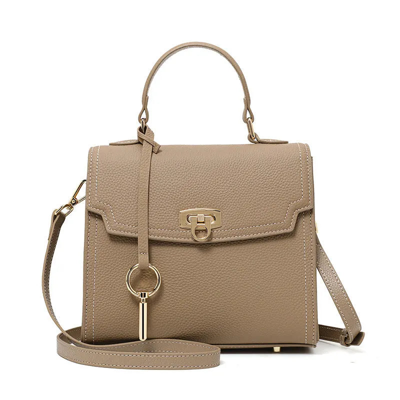 Elephant grey genuine leather crossbody handbag with litchi pattern, secure lock, and double shoulder straps