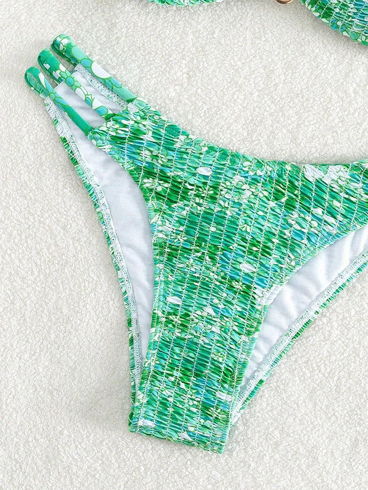 Women's floral high-waist bikini swimsuit set in solid blue colour with matching bra.