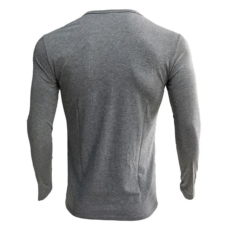 Men's long sleeved blue Henry collar pullover shirt laid flat, showing cotton blend fabric texture.
