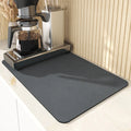 Square technical cloth dish drying mat with PU leather surface and rubber anti-slip backing.