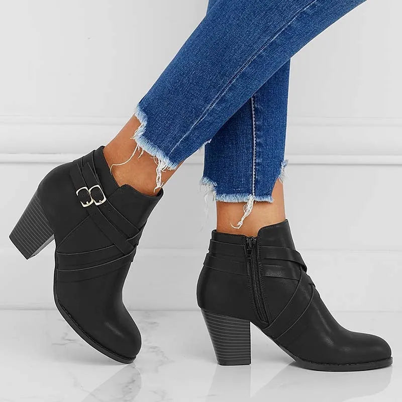 Short boots with 7cm heels in black, brown, or grey colours, showing side zipper and rubber sole