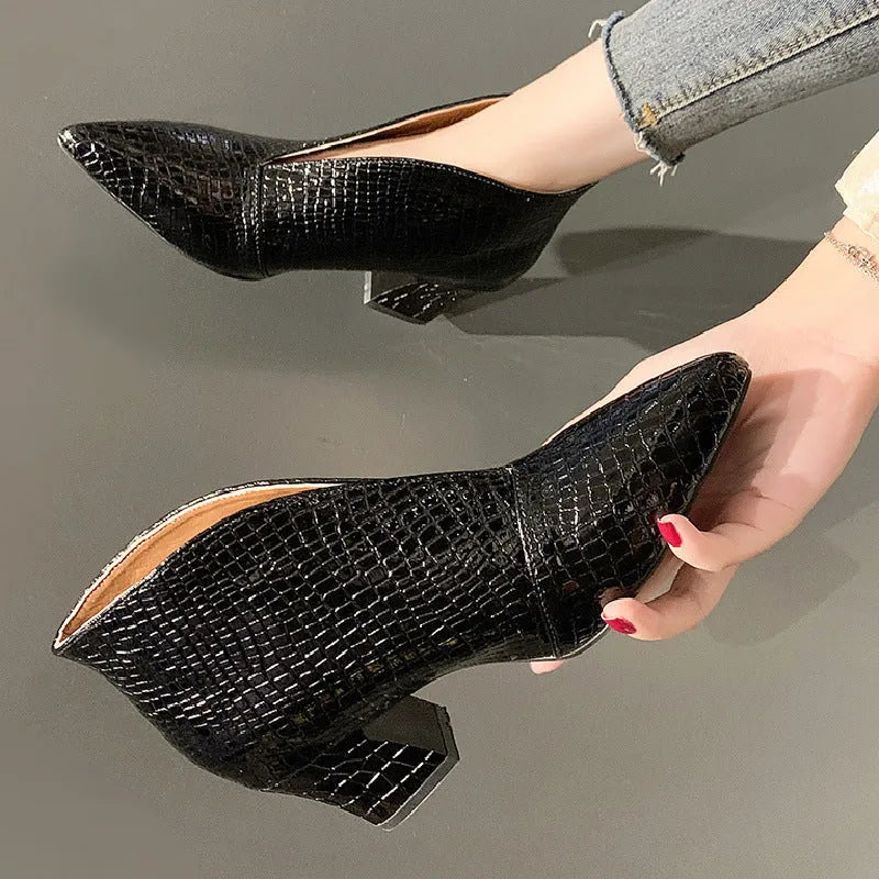 Women's V-cut ankle boots with pointed toe and embossed PU upper in black colour with chunky heel