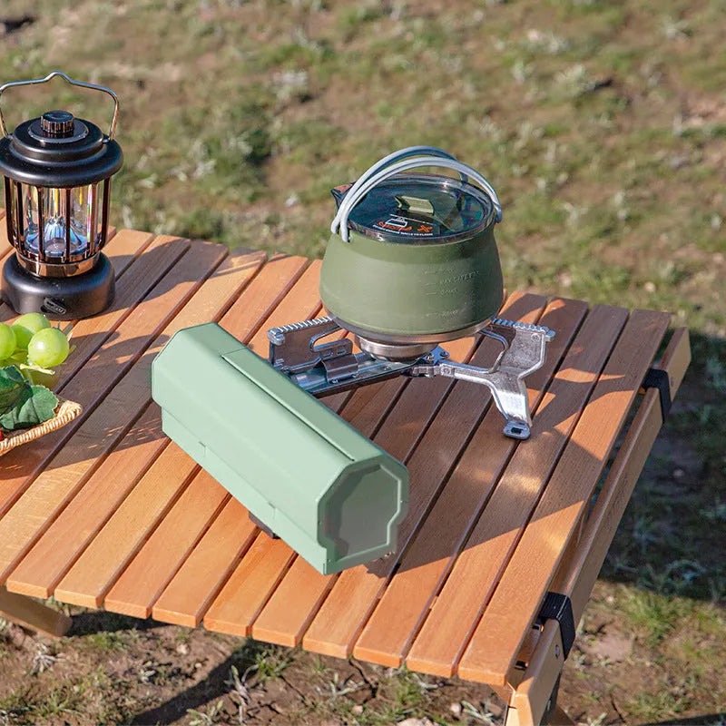 Green portable folding gas stove with adjustable valve and serrated bracket for camping