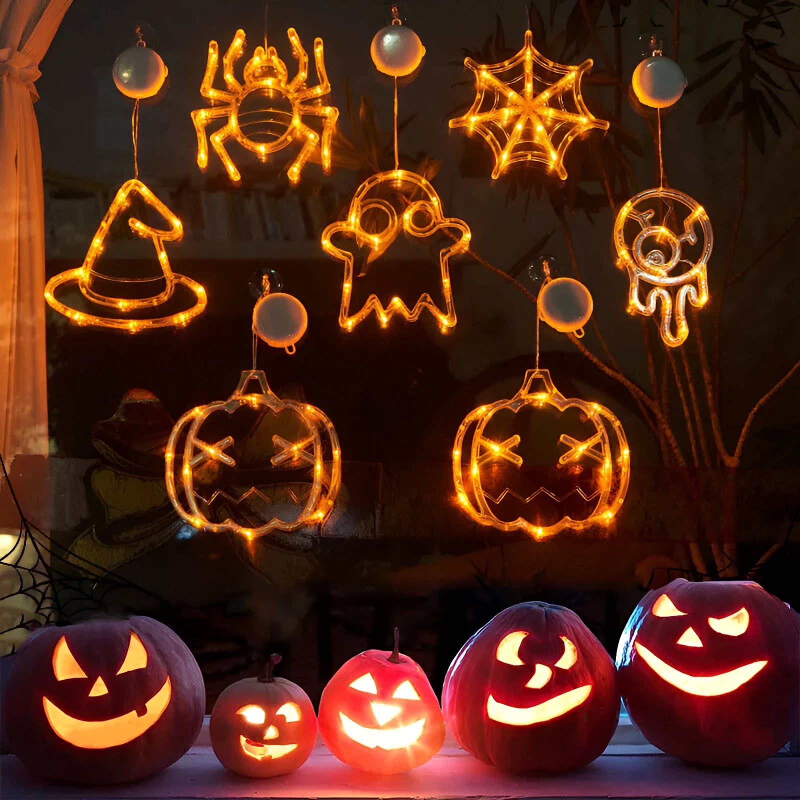 Halloween LED window lights set with spider, pumpkin and ghost designs on suction cups