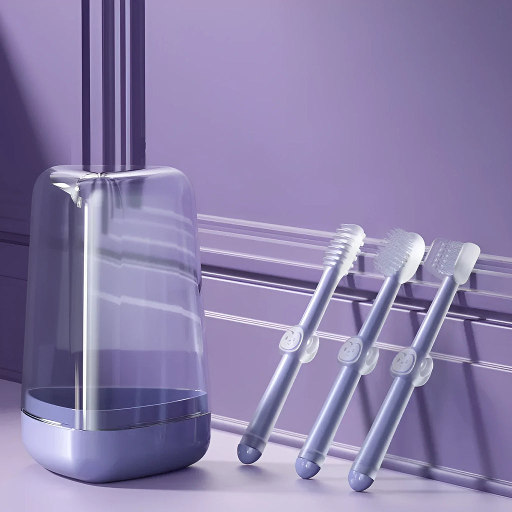 Purple soft silicone toothbrush for cleaning cat and dog teeth on a white background.