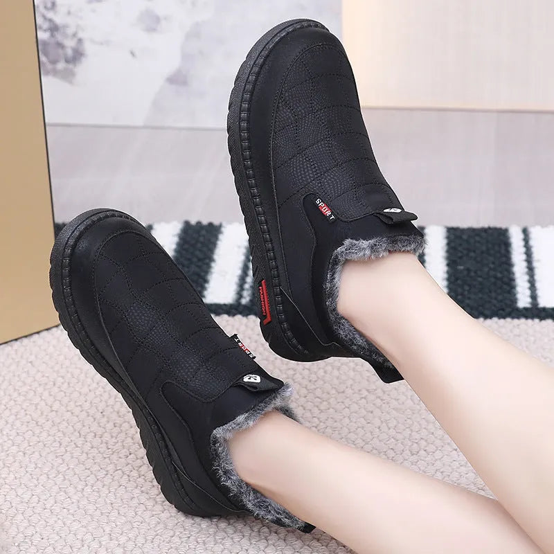 Women's black casual flat boots with round toe and non-slip rubber soles