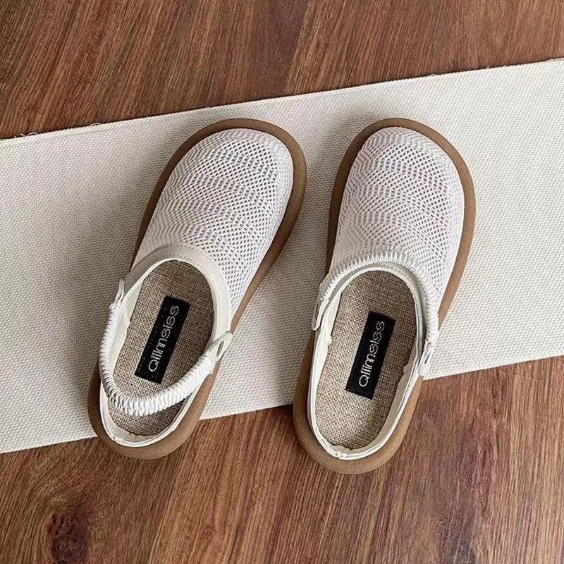 Milky white linen slip-on shoes with mesh lining, round toe, and a light rubber sole on a neutral background.