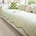 Special-shaped sofa cover in Ice Silk fabric with non-slip design, shown in Cloud Gray colour on a sofa
