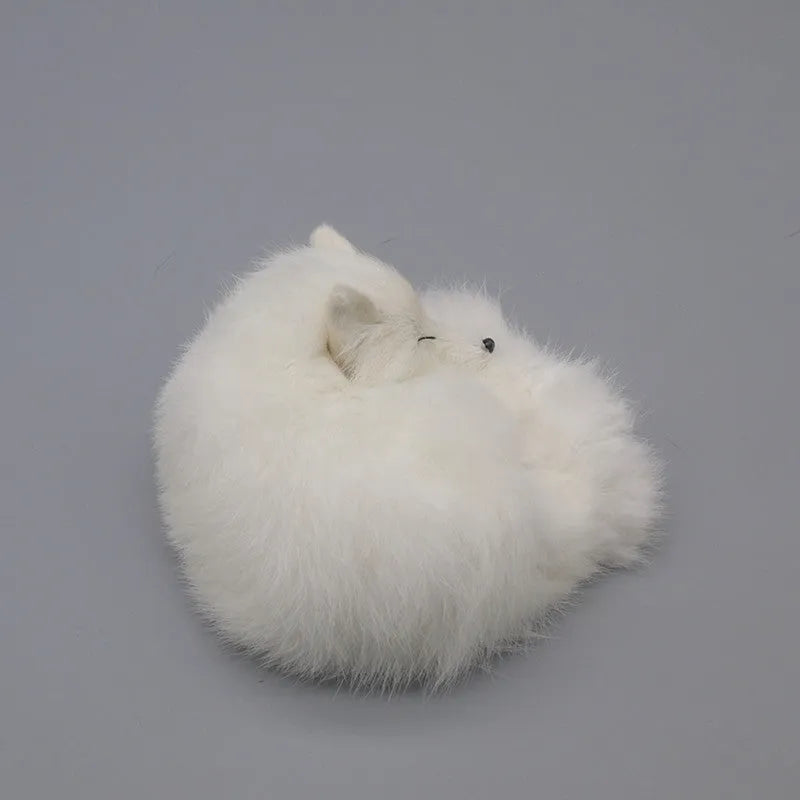 Small white artificial fox fur ornament for car or home decoration.