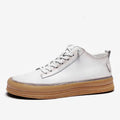 Men's black casual leather shoes with round toe, flat heel, and lanyard closure on neutral background