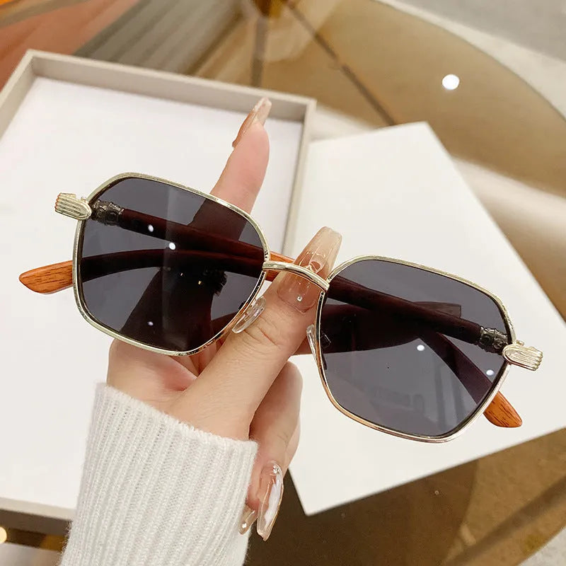 Frameless women's glasses with wood grain trim showing gold frame and double colour lens options