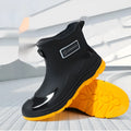 A pair of minimalist Korean-style PVC waterproof boots for adults with a non-slip sole.