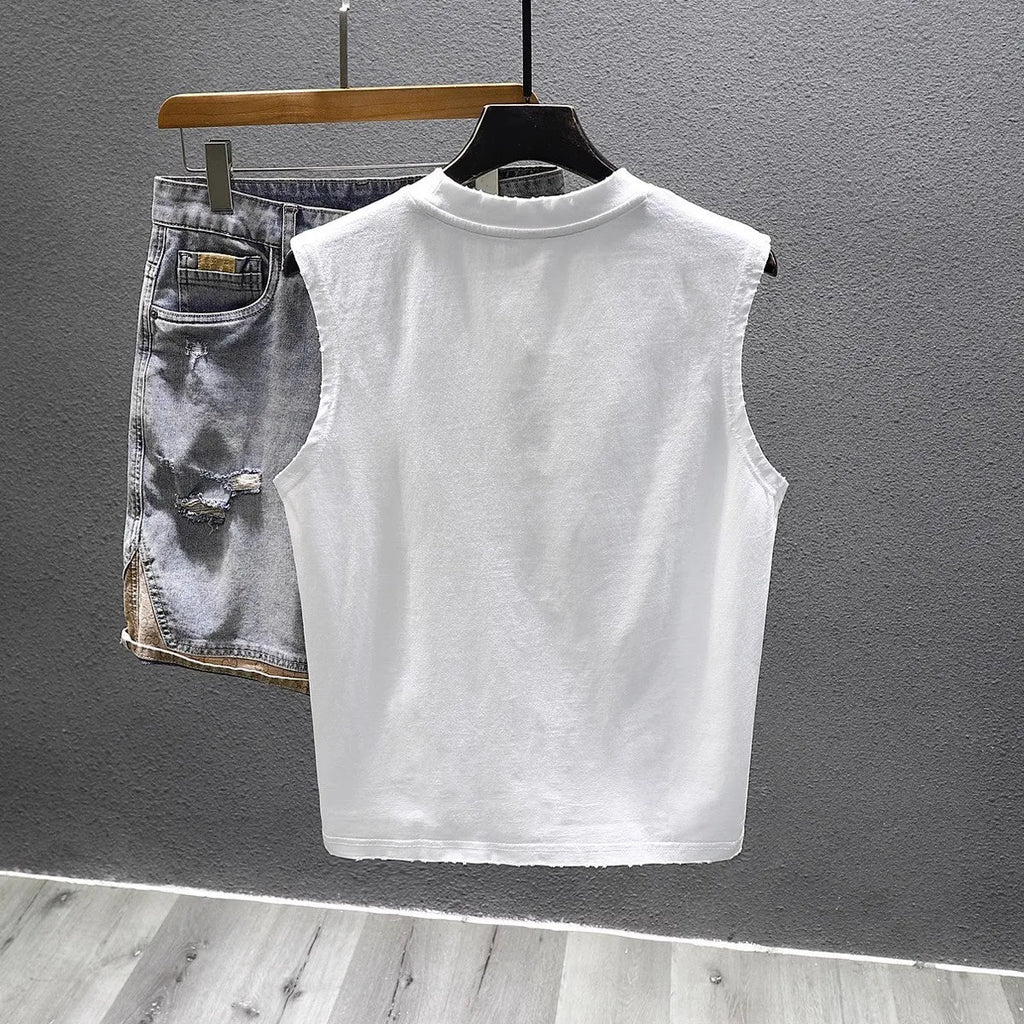 Solid colour loose fit cotton sleeveless t-shirt on a hanger, shown in black and white colour options.
