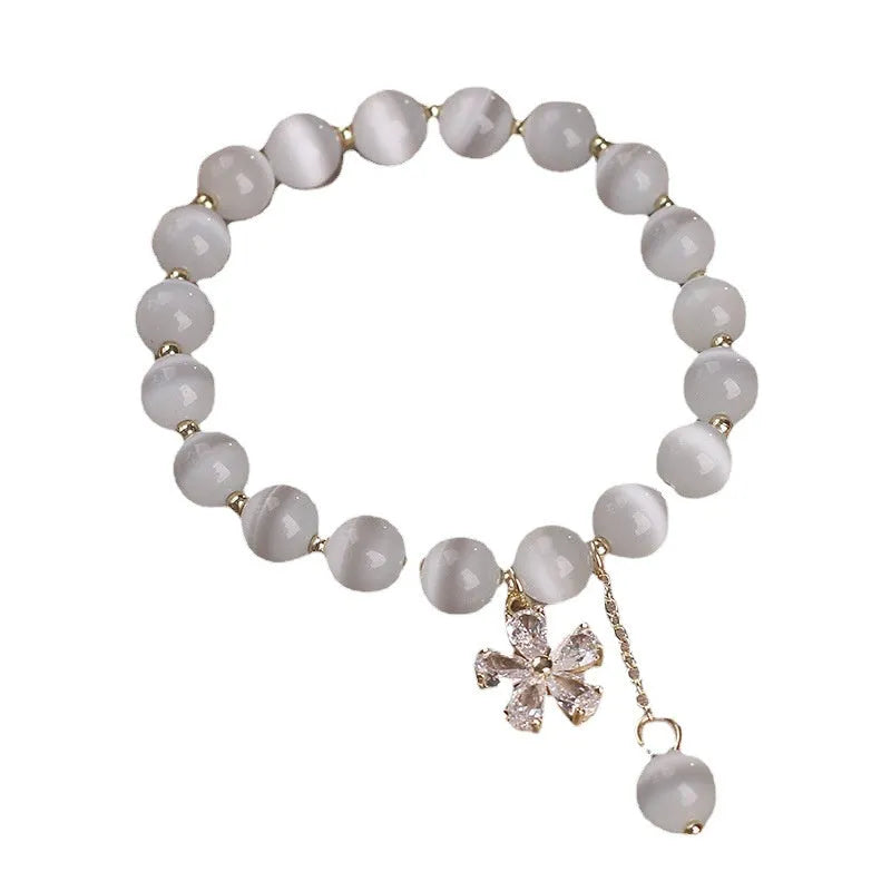 White cat's eye crystal women's bracelet with morganite safety buckle pendant and small flower tassel