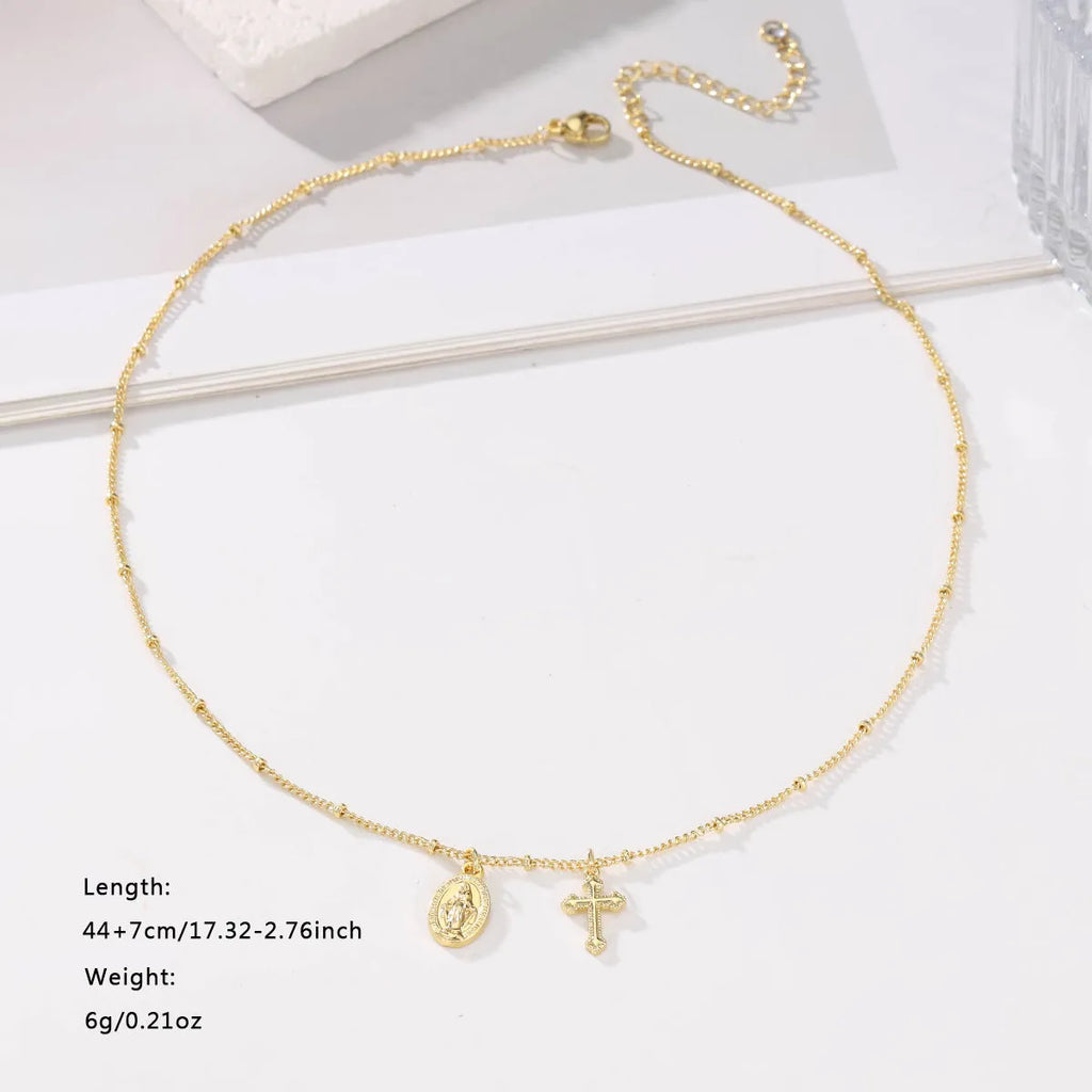 Gold geometric cross necklace on a 45cm chain with adjustable clasp