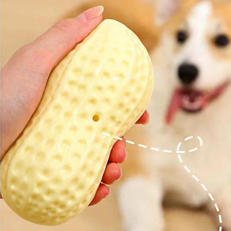 Yellow TPR peanut-shaped dog chew toy with textured surface and squeaker function