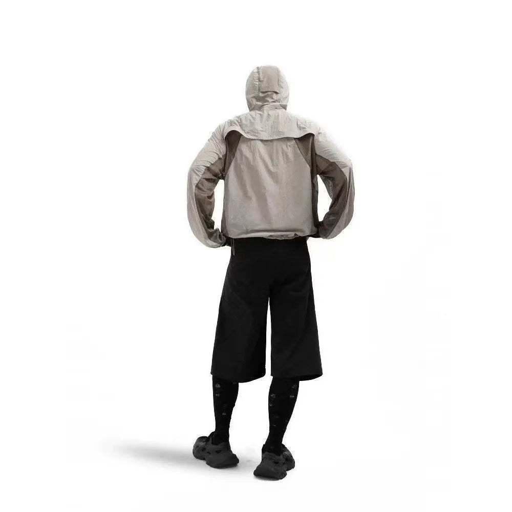 Mesh-stitched nylon sun protective clothes in desert brown, available in sizes M to 2XL.