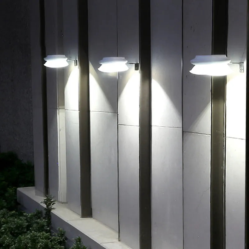 Solar-powered outdoor fence wall lamp with Southeast Asian design in black or white shell options