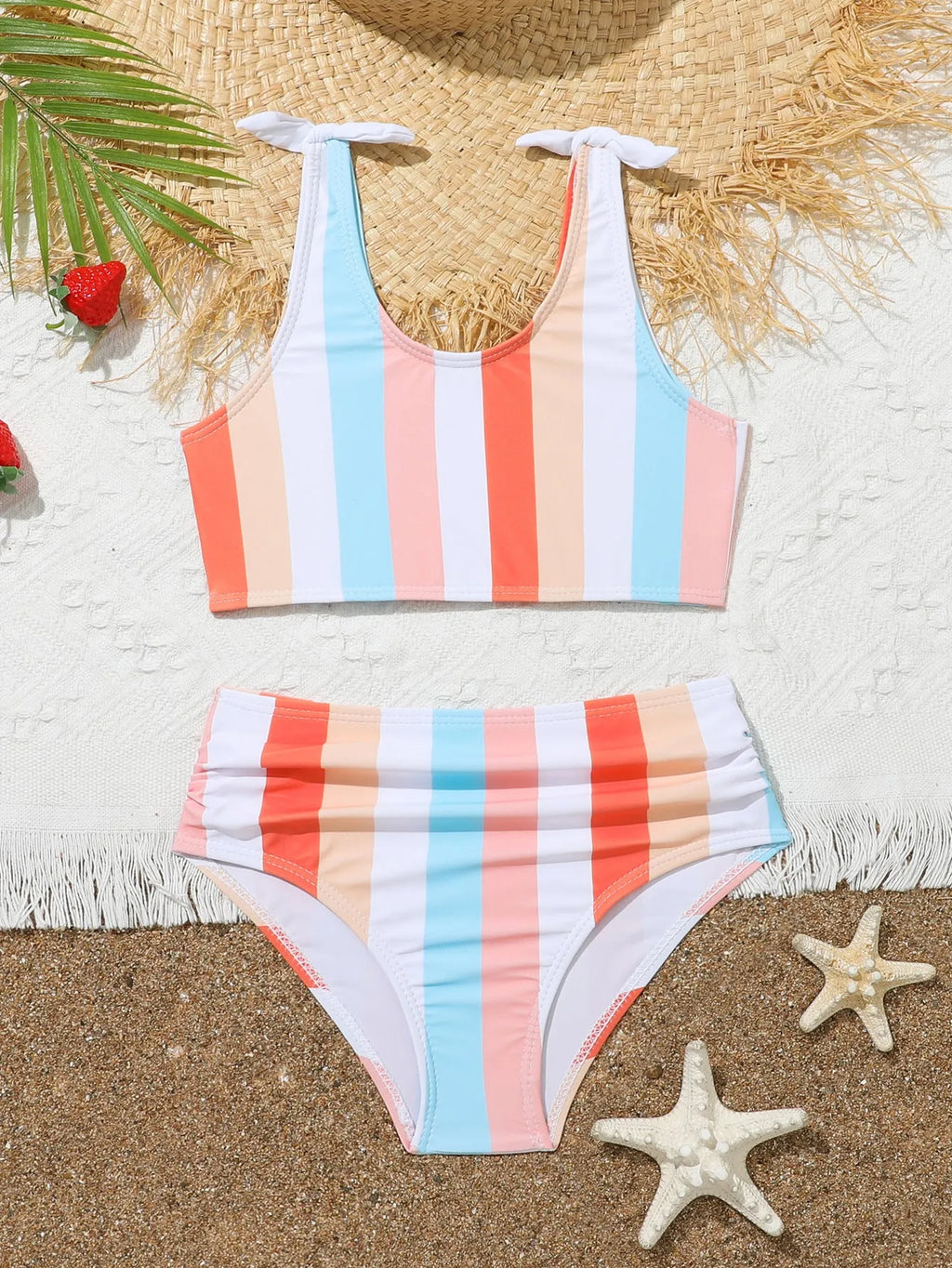 Girls plaid print swimsuit briefs with bra top, shown in multiple toddler and child sizes.