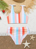 Girls plaid print swimsuit briefs with bra top, shown in multiple toddler and child sizes.