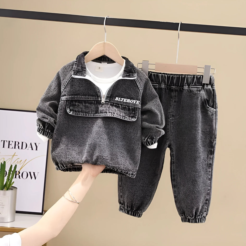 Boys' blue denim two-piece suit set with long sleeves, showing top and trousers laid flat.