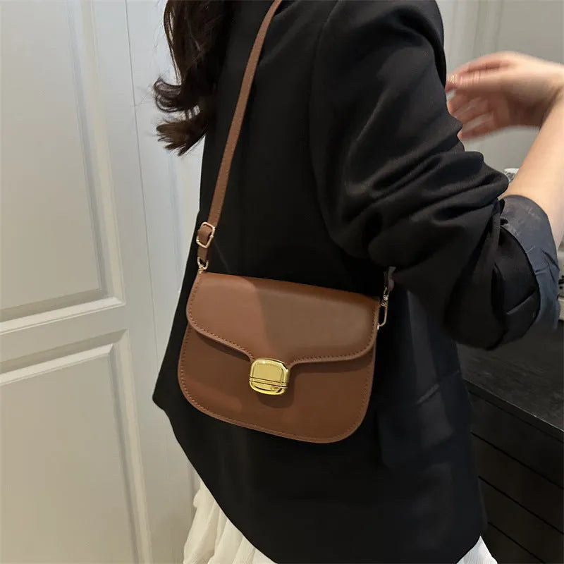 Women's PU leather handbag showing internal zipper pocket and phone compartment in available colours