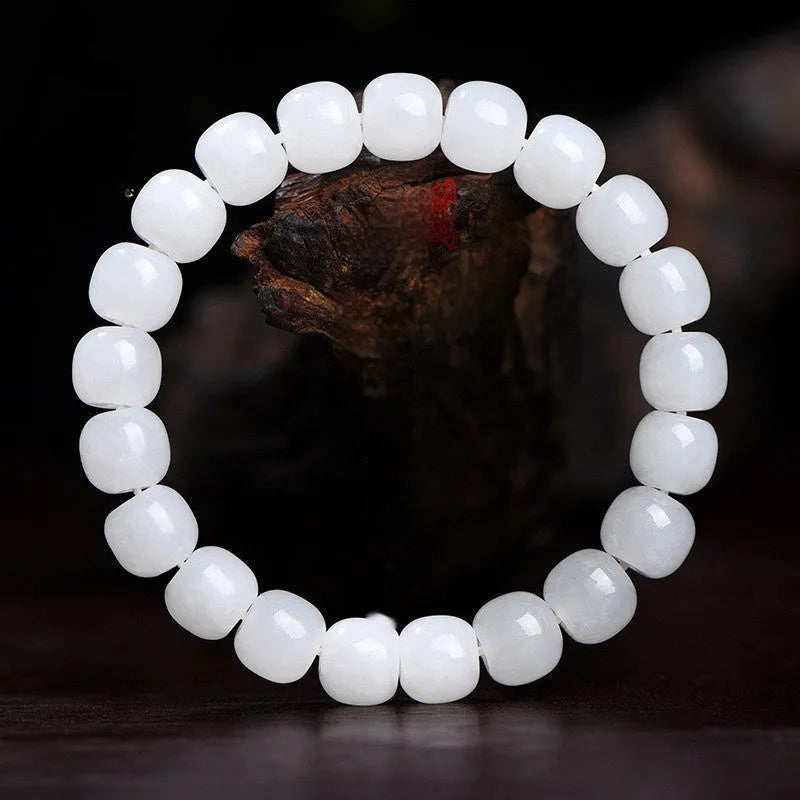 White jade barrel beads bracelet on wrist, showing Hetian jade beads in casual unisex design