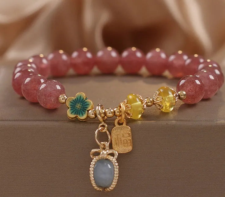 Red strawberry quartz beaded bracelet with alloy setting and rhinestone decoration