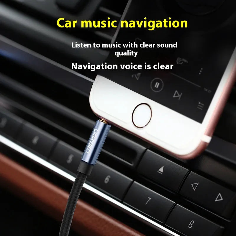 3.5mm aux audio cable with silver-plated connectors and black woven mesh outer cover, coiled and ready for use