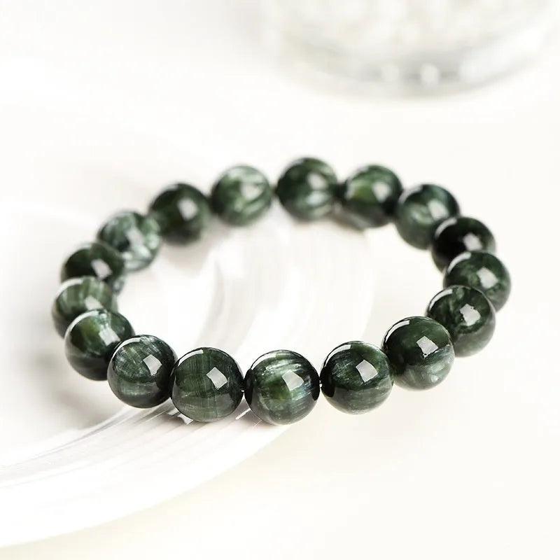 Green Dragon Crystal bracelet with 8-9mm round beads showing Ruyi design detail and geometric shape