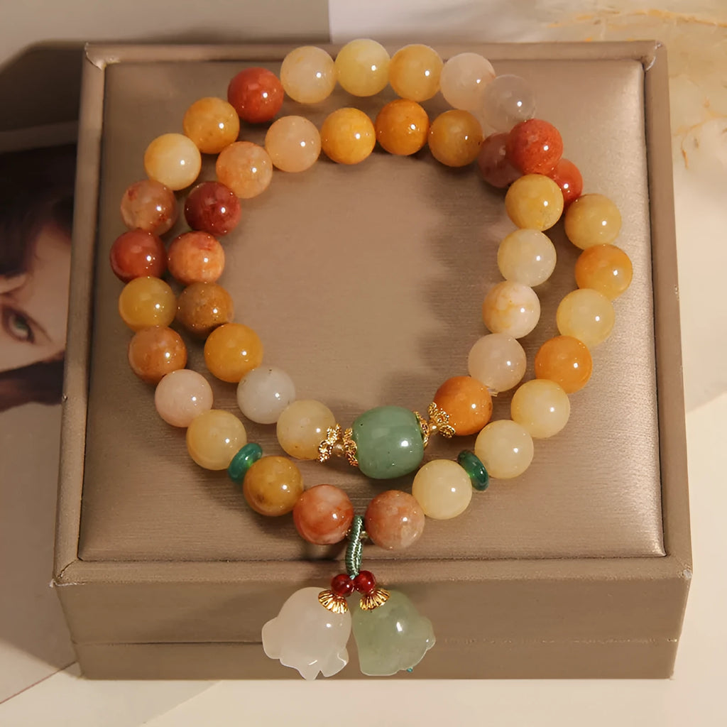Natural jinsi jade multi-layer bracelet for women showing adjustable knotted design with orchid pendant detail