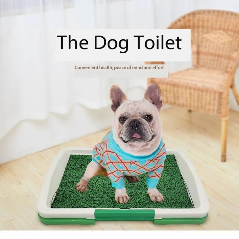 Green artificial grass dog toilet training tray with three-layer construction on a balcony.
