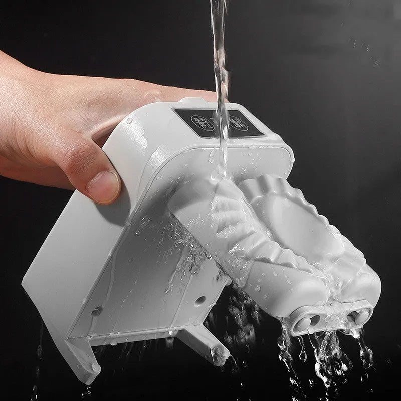 White electric dumpling maker machine with USB charging cable, brush, and spoon.