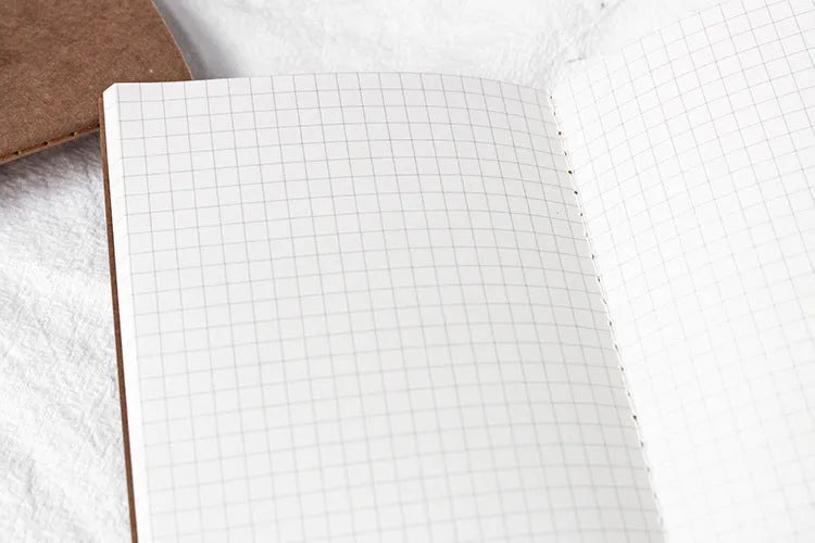 Cowhide diary refill inner core showing 11x21cm size and saddle stitch binding