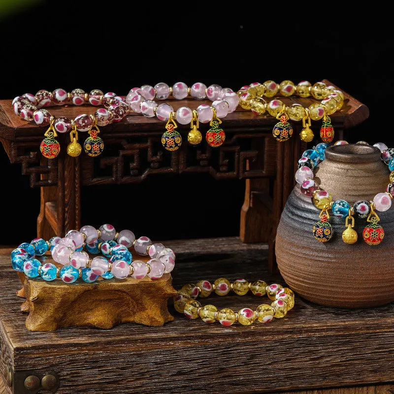 Handmade ancient fluorescent glaze bracelet with swallowing gold beast design on 10mm heart-shaped beads