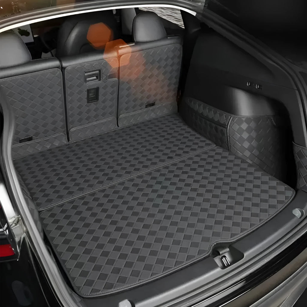 Leather trunk mat for Tesla Model 3 and Model Y in black, shown in car boot.