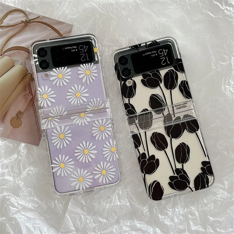 Clear Samsung Galaxy Z Flip phone case with floral pattern, available in Daisy and Tulip designs.