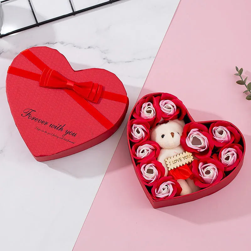 Heart-shaped red gift box containing scented soap roses for bath use