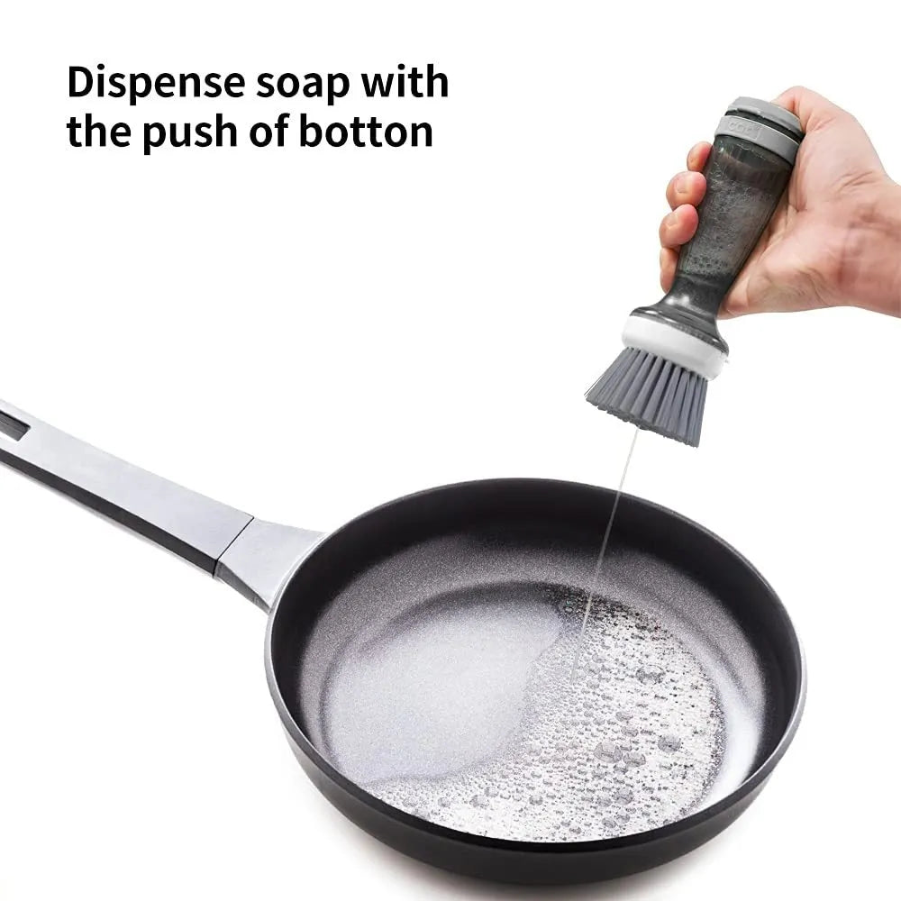 Milk white and mint green kitchen pot brush with soap dispenser in handle and replaceable brush head.